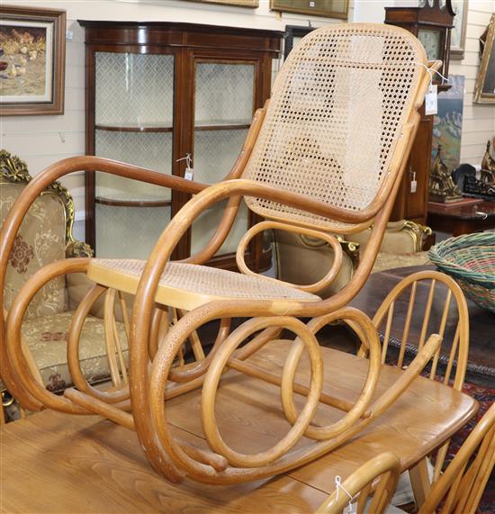 A caned bentwood rocking chair